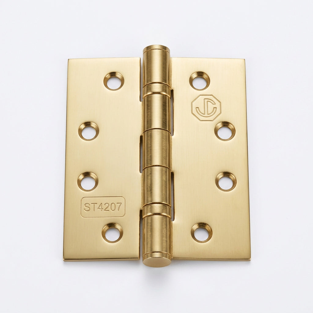 A pair of brass cabinet hinges with six mounting holes on each leaf, shown on a plain white background.